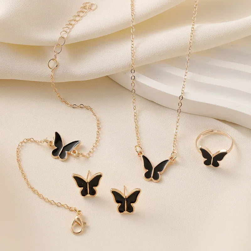 Ensemble Élégant Papillon – Collier, Boucles, Bracelet & Bague