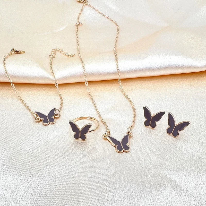 Ensemble Élégant Papillon – Collier, Boucles, Bracelet & Bague