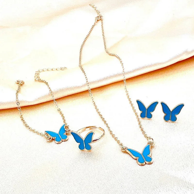 Ensemble Élégant Papillon – Collier, Boucles, Bracelet & Bague